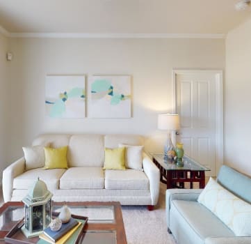 a living room with a couch and a chair