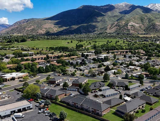 A small town with a mountain in the background.