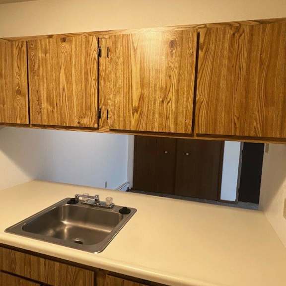 a bathroom with a sink and a toilet and a shower