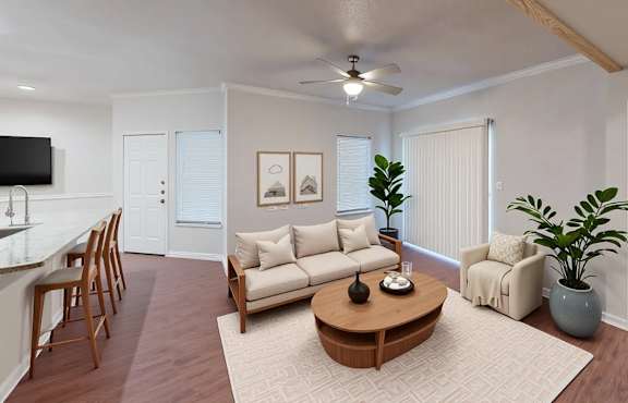 A living room with a brown coffee table and a white couch.