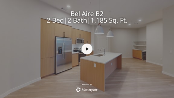 A kitchen with a refrigerator, sink, and countertop is shown in a video thumbnail.
