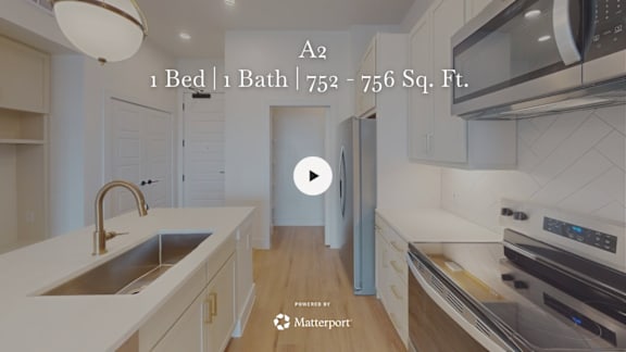 A kitchen with a sink, stove, and oven.