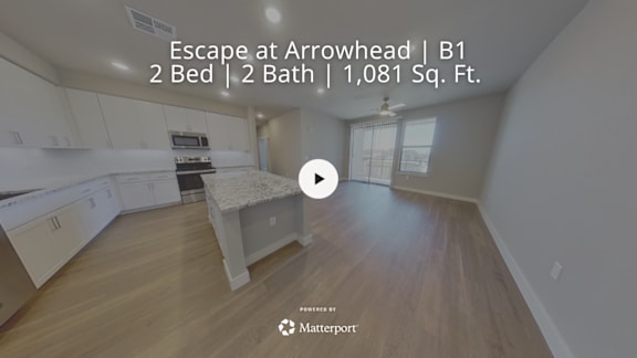 A video thumbnail showing a kitchen and living room of a 1,081 square foot, two bedroom, two bathroom home at Arrowhead.
