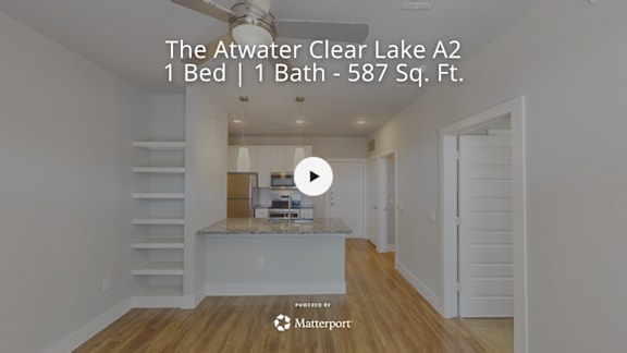 A video thumbnail for a property listing titled "The Atwater Clear Lake A2" showing a bedroom with a bed and a bathtub.