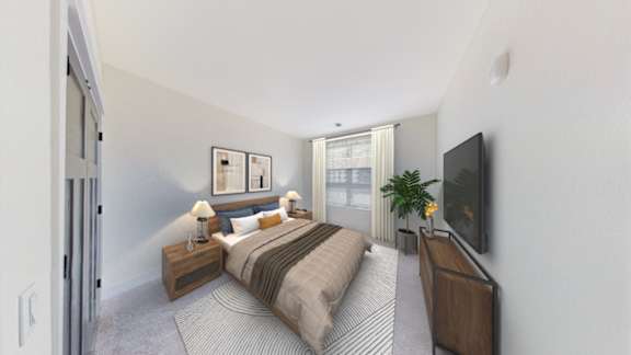 A bedroom with a bed, nightstands, and a television.