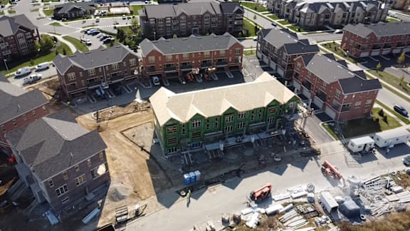 an aerial view of a building under construction in a city
