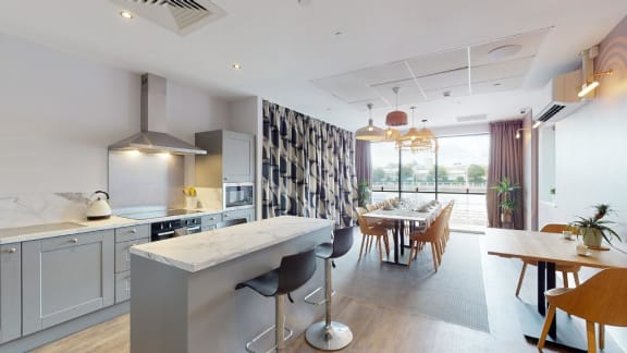 a kitchen and dining room with a table and chairs