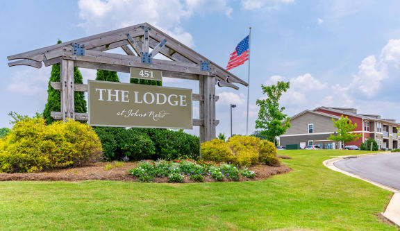 the lodge apartments entrance sign