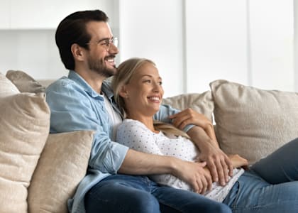 a man and a woman sitting on a couch