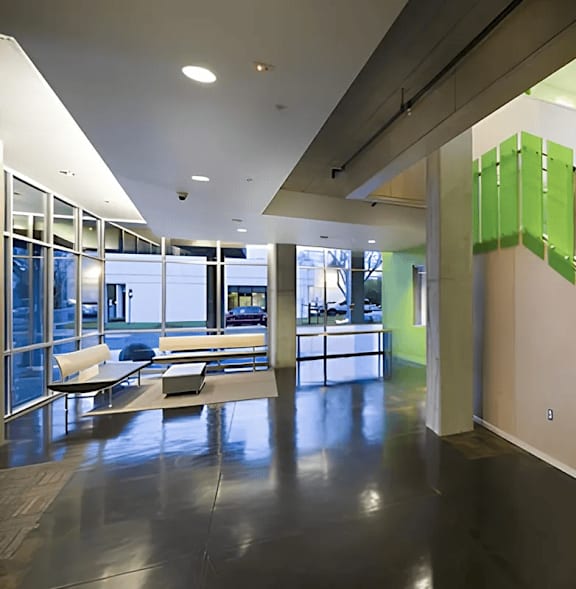 A staircase with green panels on the wall.