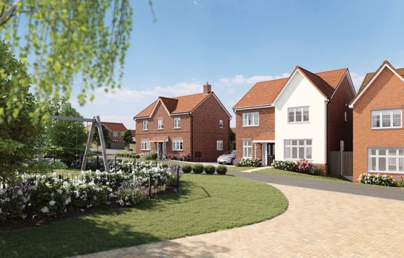 a development of new town houses on a street with a garden