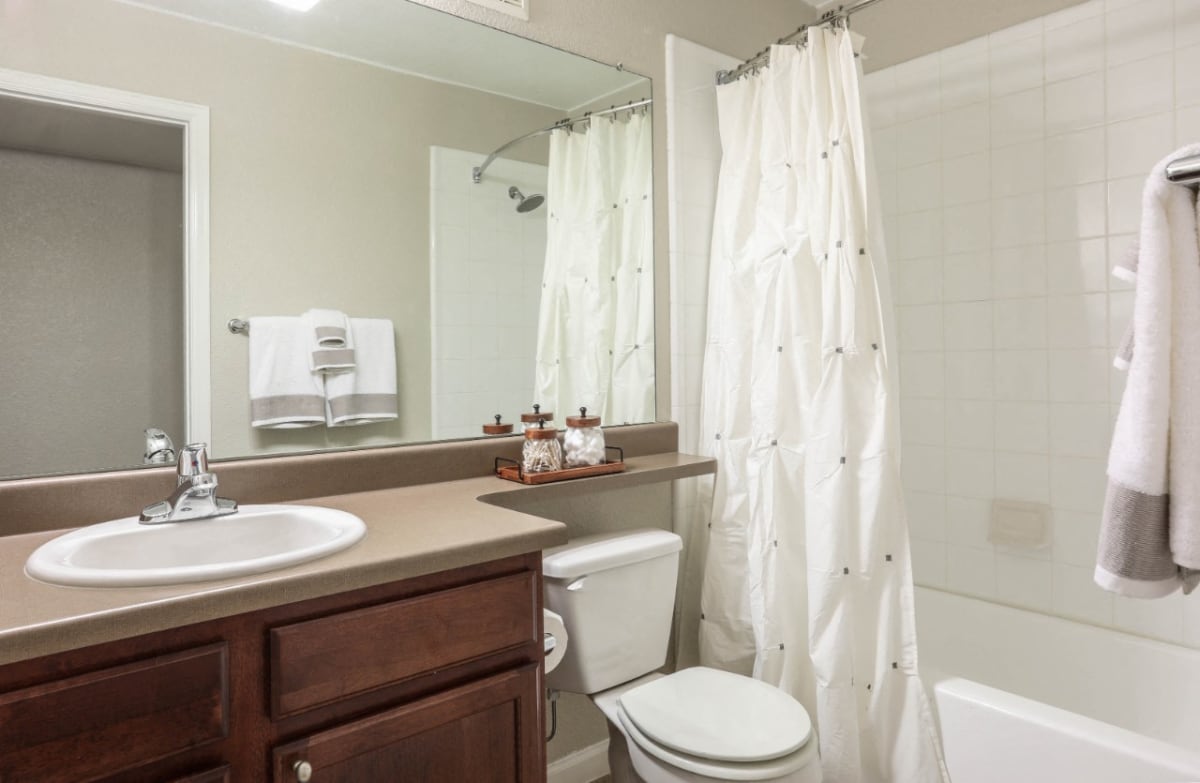 Copper Flats bathroom with tub and vanity - Aurora, CO