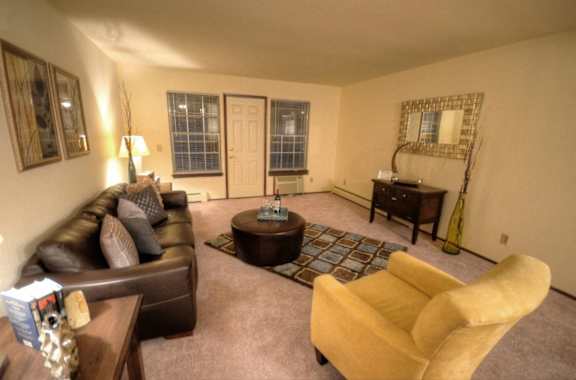 a living room with a couch and a table
