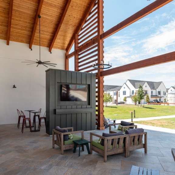 a living room with a tv and a patio