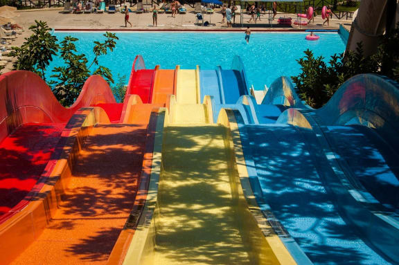 a young girl sliding down a water slide at Linkhorn Bay Apartments, Virginia Beach, VA, 23451
