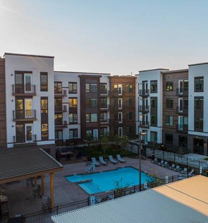 Meritage West Apartments in Boise, Idaho Exterior and Pool with Lounge Chairs