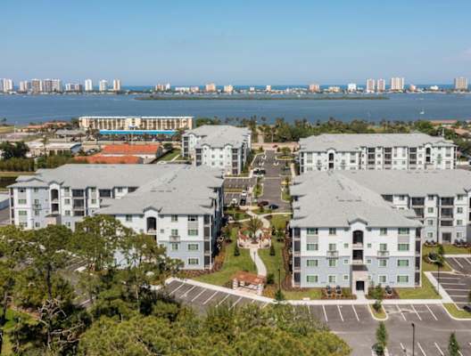 multiple squares and triangles with people in a field at Enclave at 3230 Apartments, South Daytona, 32119