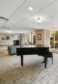 a grand piano in the lobby of a building