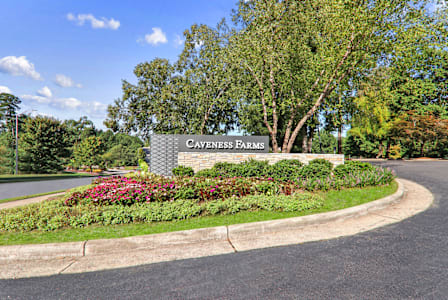 a view of the cul de sac sign with trees and flowers in the background