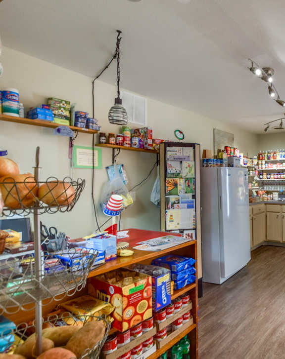 A small grocery store with a variety of products on display.