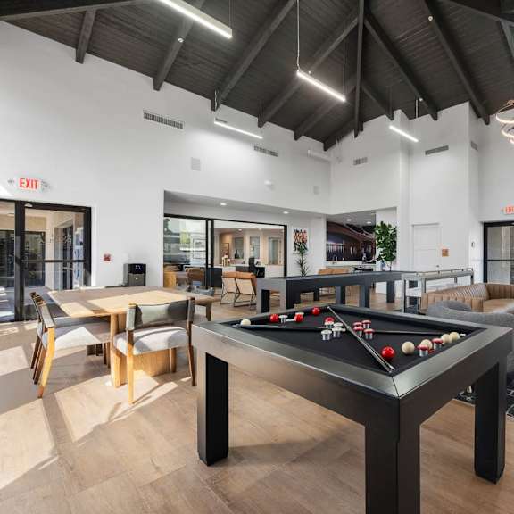 A gym with treadmills, elliptical machines, and other exercise equipment.