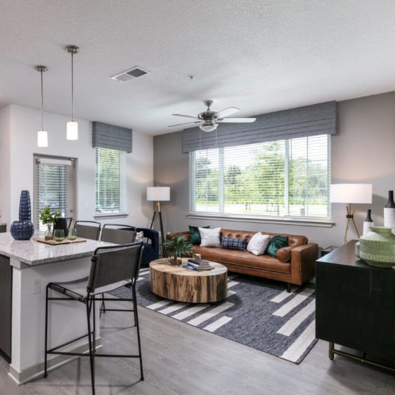 a large fitness room with treadmills and other exercise equipment at Enclave at 3230 Apartments, South Daytona, 32119