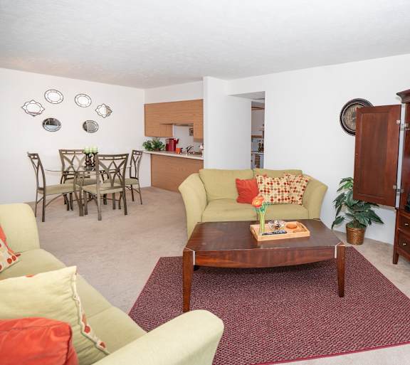 a living room with a couch and a table and a television