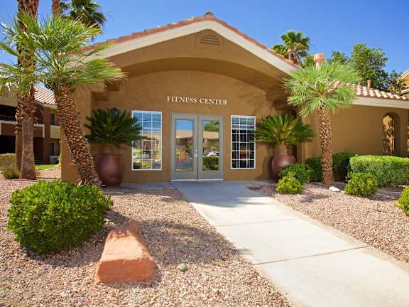 a building with palm trees in front of it