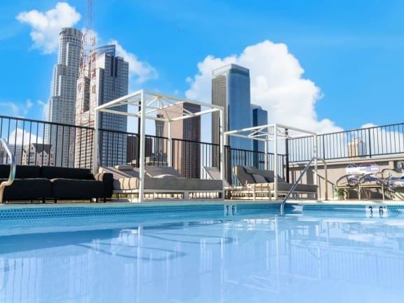 a swimming pool with a city skyline in the background