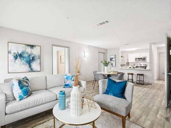 Model living room and dining area at Mirage at Kernan Apartment in Jacksonville, FL