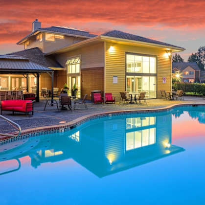 A house with a pool in the backyard.