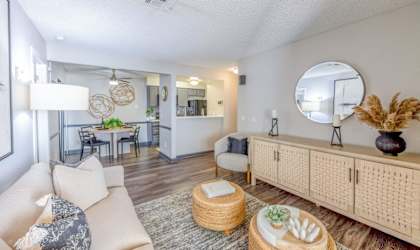 a living room with couches and chairs and a table