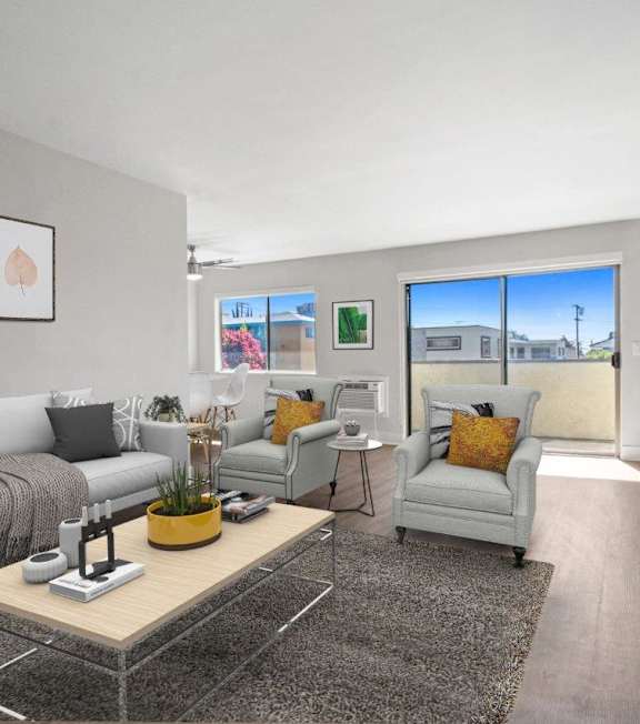 a living room with a spiral staircase and a couch and a table at Oasis Apartments, Burbank, CA