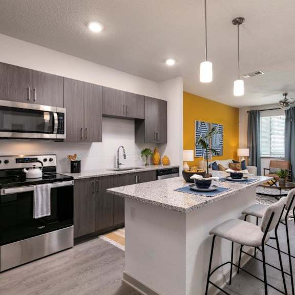 a large swimming pool with a pergola and palm trees in the background at Enclave at 3230 Apartments, South Daytona, 32119