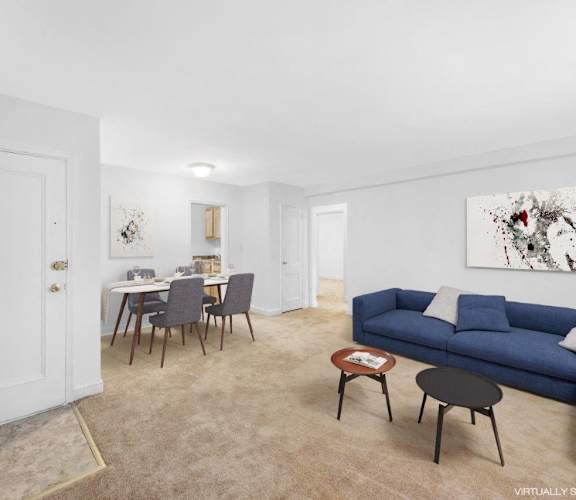 a living room and dining room with a couch and a table