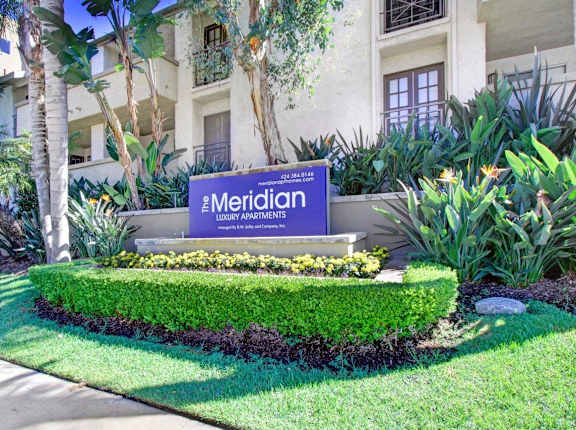 A sign that says Meridian in front of a building at Meridian Apartments, Los Angeles, CA
