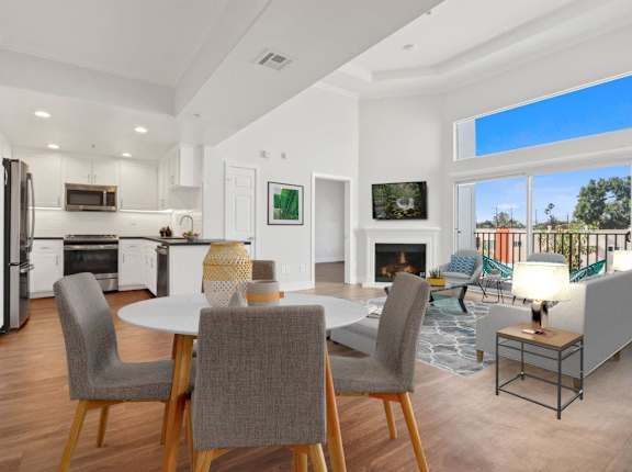 A modern kitchen with a dining table and chairs at Toluca Court, Toluca Lake