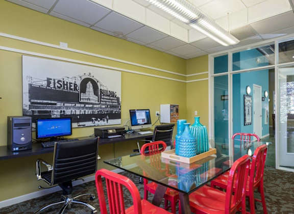 a conference room with a glass table and chairs at Village Club of Royal Oak, Royal Oak, 48067