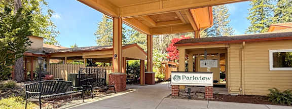 A building with a sign that says Parkview in front of it.