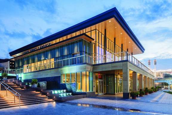 A modern building with a blue roof and glass windows.at Sky Central, Cincinnati Ohio