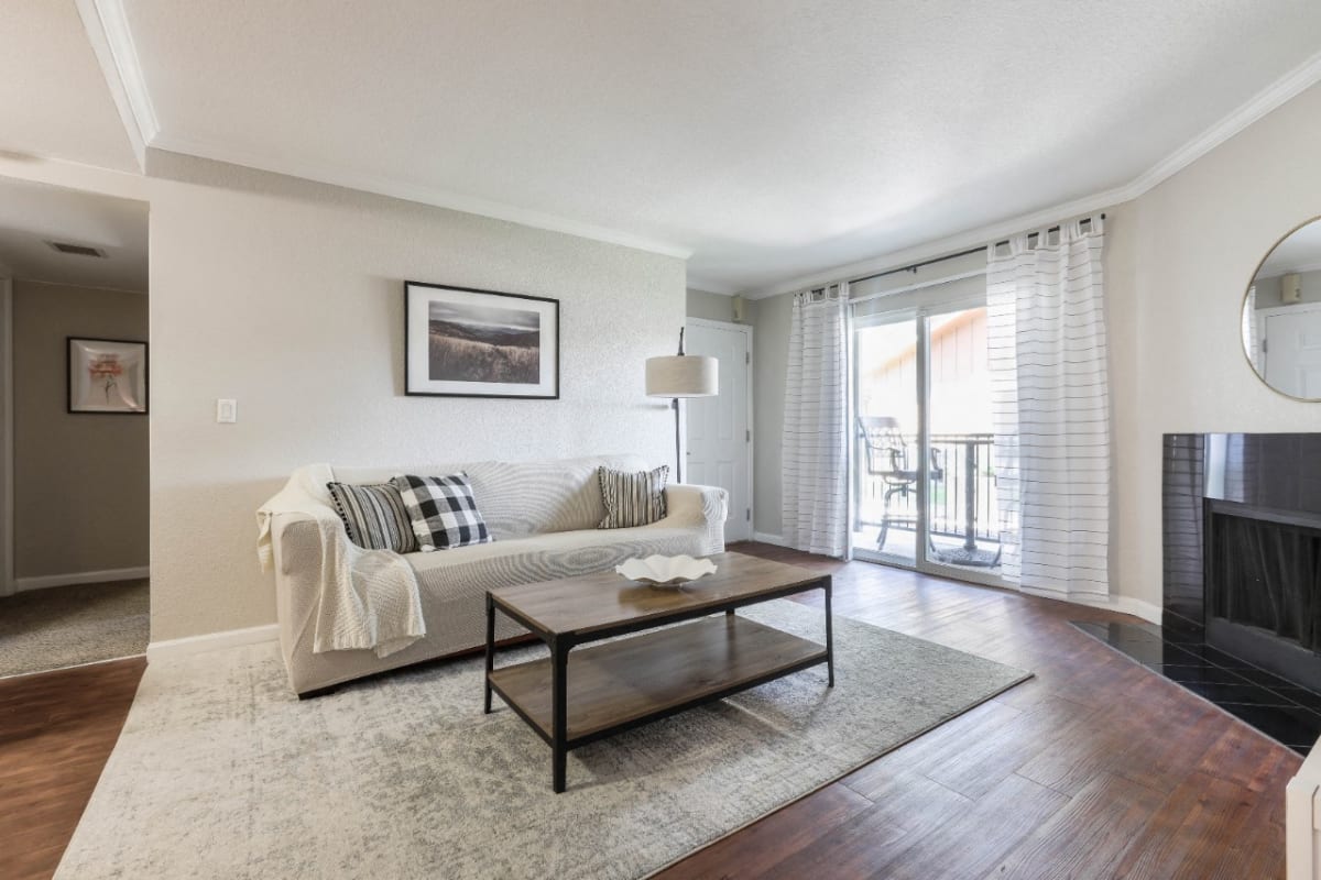 Copper Flats living room with fireplace and sliding door - Aurora, CO