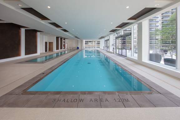 A long rectangular swimming pool with a shallow area of 12 meters.