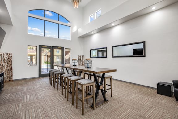 Clubhouse with high roof and couch at San Fernando Apartments, Mesa