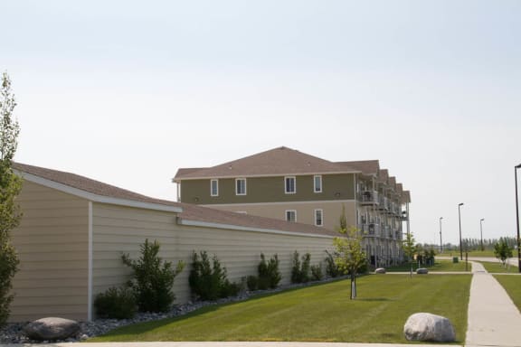 a building with a grassy area in front of it