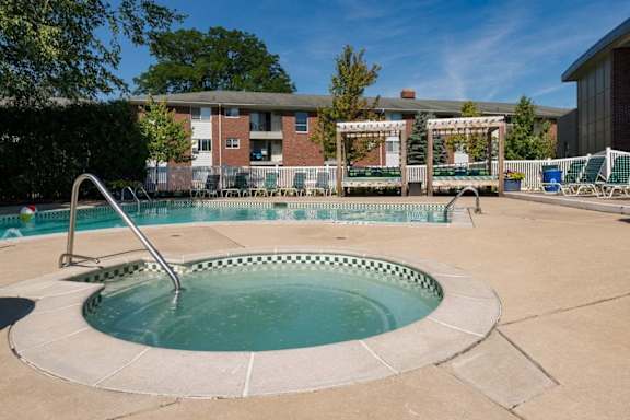 our apartments have a hot tub and a pool at Village Club of Royal Oak, Michigan