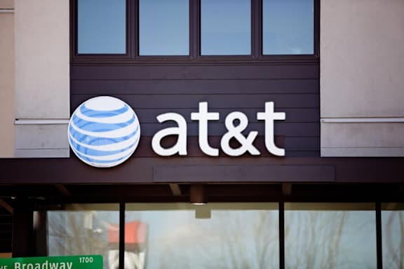 The image shows the exterior of an AT&T store with a large sign above the entrance.