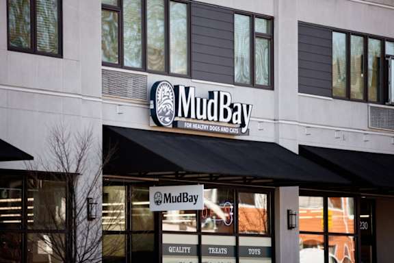 A storefront of Mud Bay, a pet store, is shown.