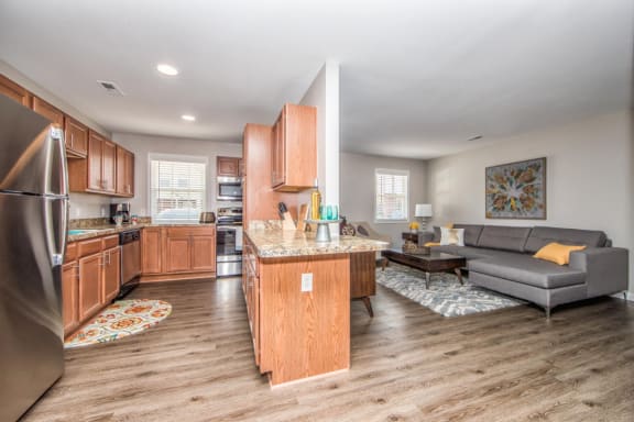 View of kitchen and living room at Villages at City Center apartments in Newport News VA