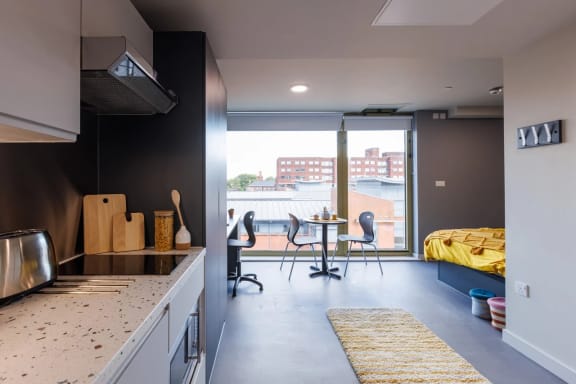 a kitchen and dining area in a 555 waverly unit