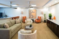 clubhouse with couches chairs and a coffee table